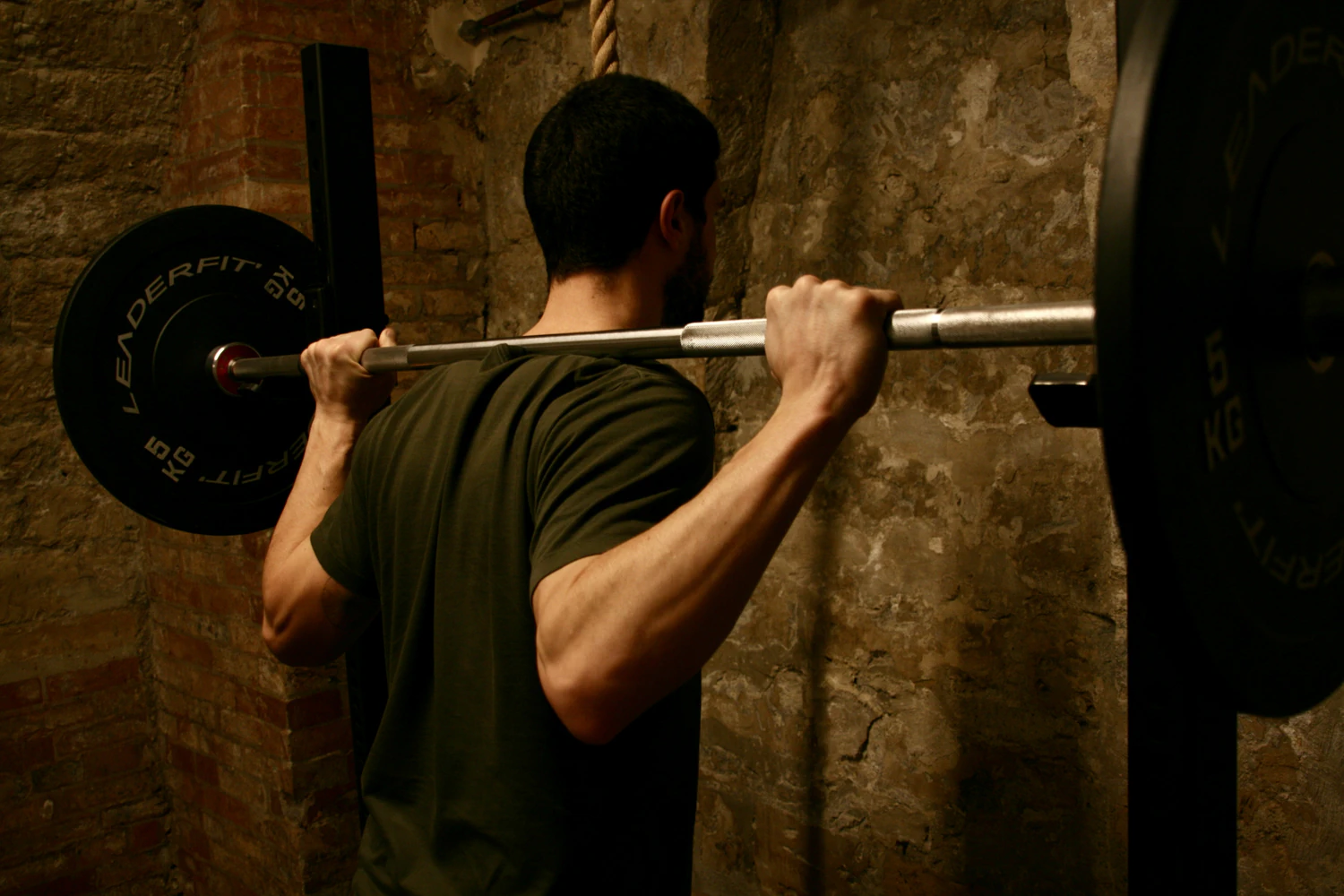 Man lifting weights in a gym