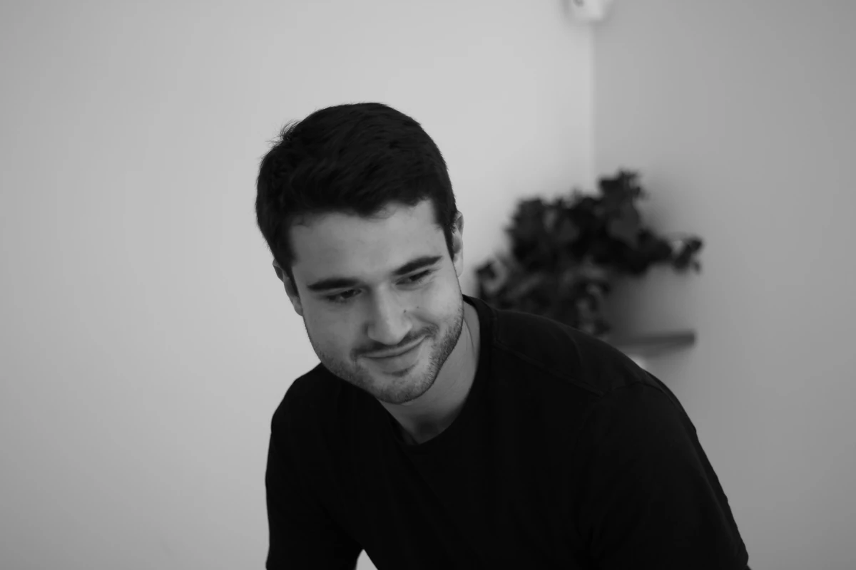 Smiling person in black and white portrait